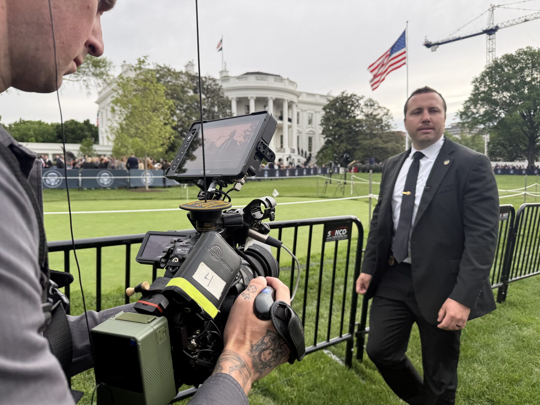 Documentary camera operator shooting on the White House South Lawn
